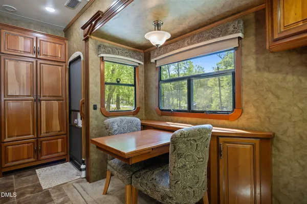 a stove top oven sitting inside of a kitchen