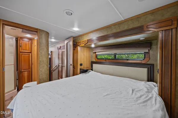 a room with a window and a cabinet