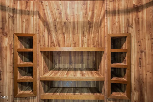 a view of a house with a yard and fence