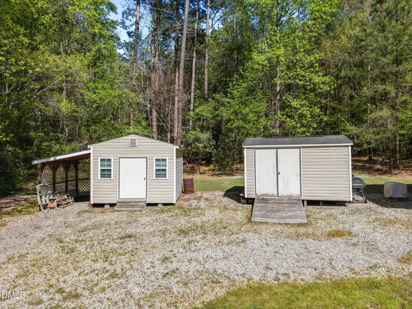 a bathroom with a sink a toilet and a shower