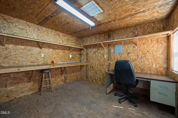 an aerial view of a house with a yard basket ball court and outdoor seating