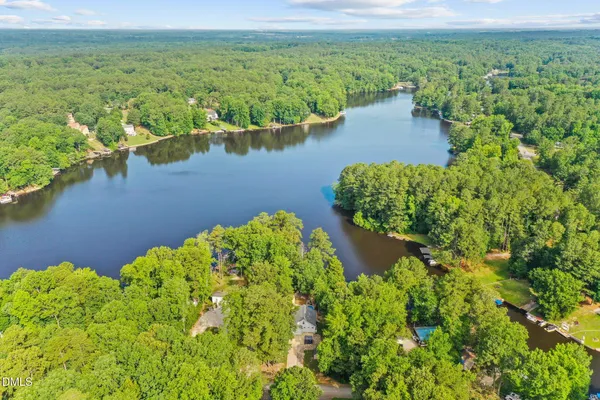 a view of a swimming pool with a yard