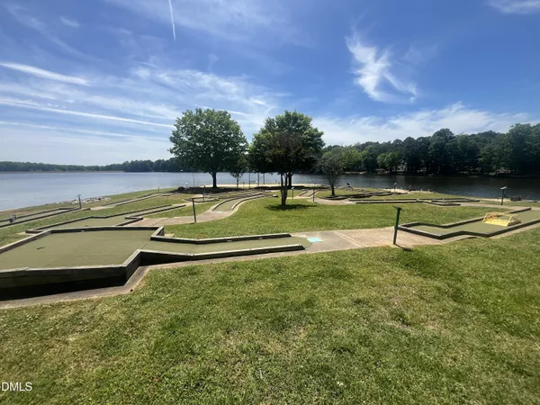 a roof deck with dining table and chairs