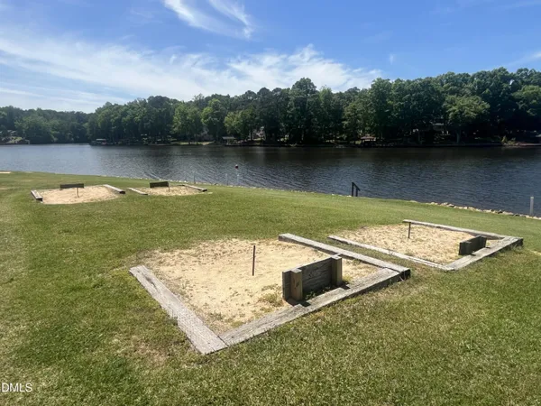 a view of a chairs and table in a backyard