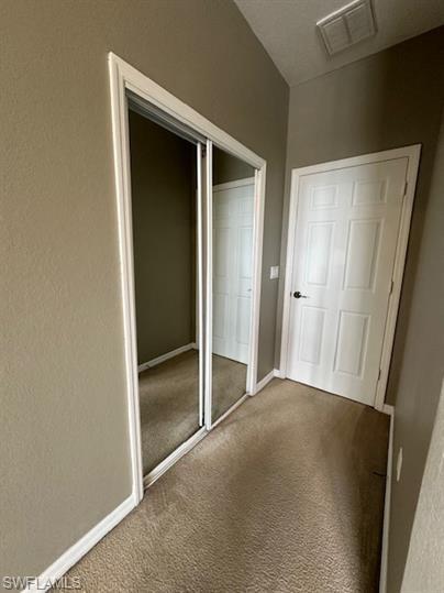 14732 Sutherland Avenue, Unit 332 Naples, FL 34119 - Photo 16 of 35 a view of an empty room with closet