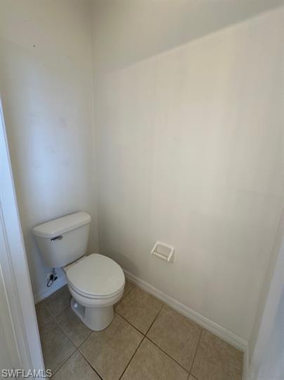 14732 Sutherland Avenue, Unit 332 Naples, FL 34119 - Photo 18 of 33 Bathroom featuring baseboards and light tile patterned floors
