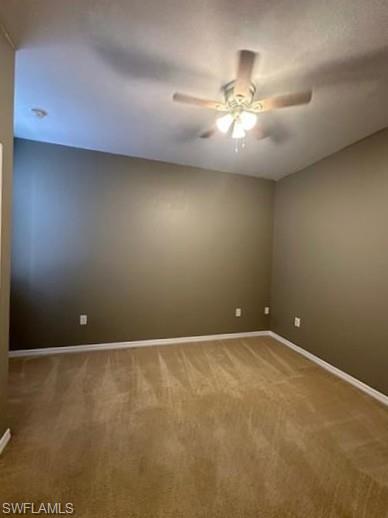 14732 Sutherland Avenue, Unit 332 Naples, FL 34119 - Photo 19 of 33 Spare room featuring light colored carpet and ceiling fan