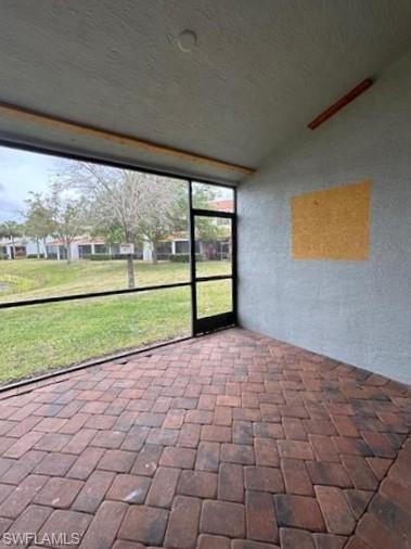 14732 Sutherland Avenue, Unit 332 Naples, FL 34119 - Photo 27 of 33 View of unfurnished sunroom