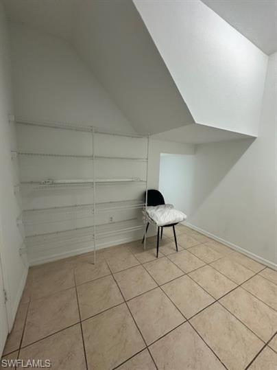 14732 Sutherland Avenue, Unit 332 Naples, FL 34119 - Photo 31 of 35 a view of a bench in a room