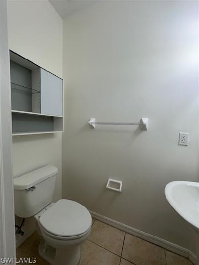 14732 Sutherland Avenue, Unit 332 Naples, FL 34119 - Photo 6 of 33 Bathroom with baseboards and light tile patterned floors