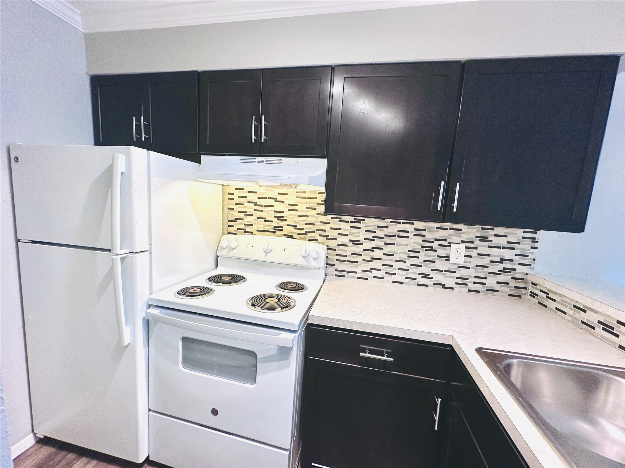3702 South 2nd Street, Unit 219 Austin, TX 78704 - Photo 3 of 11 a kitchen with a refrigerator sink and stove