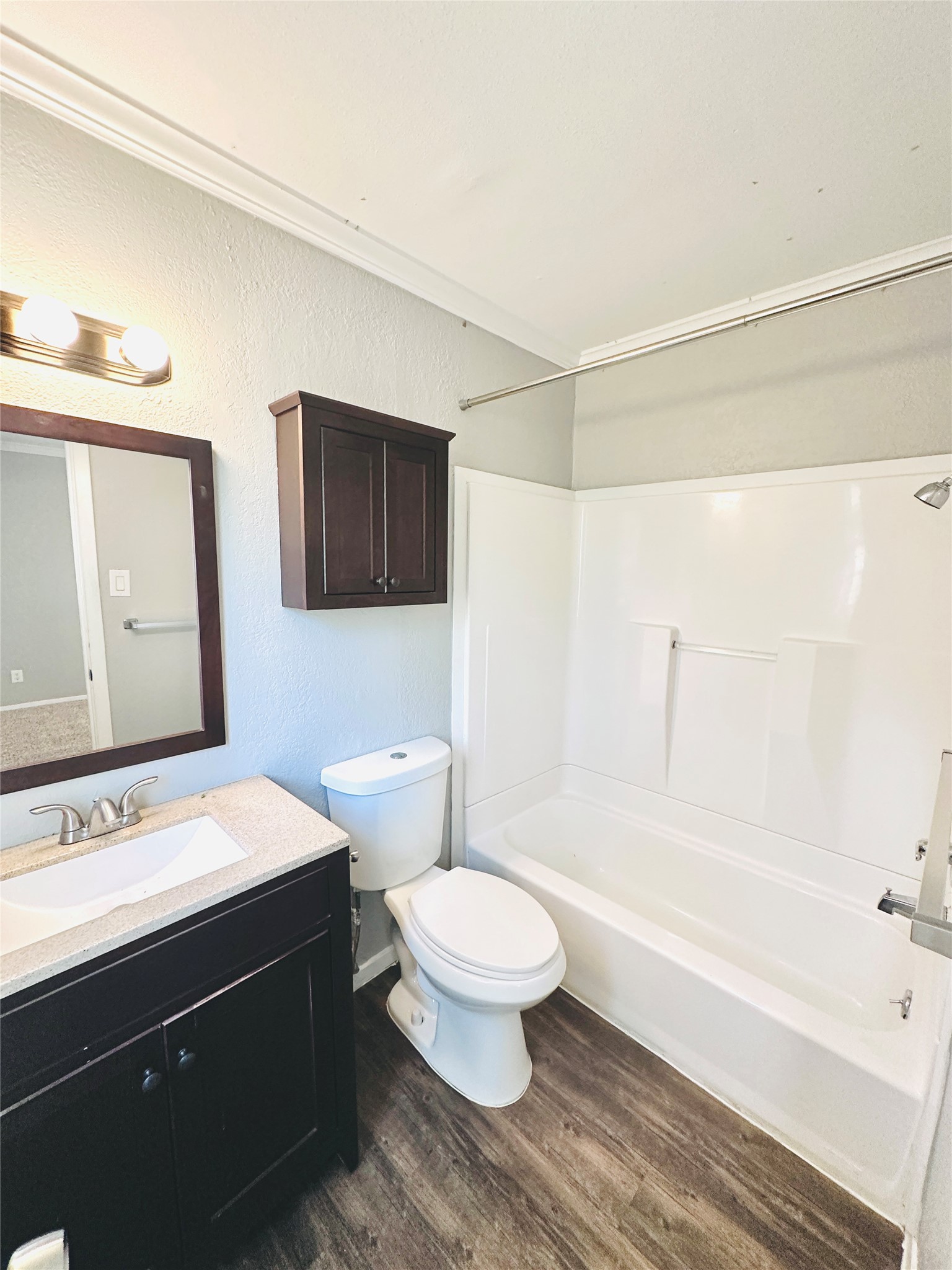 3702 South 2nd Street, Unit 219 Austin, TX 78704 - Photo 10 of 11 a bathroom with a sink a toilet and a bathtub