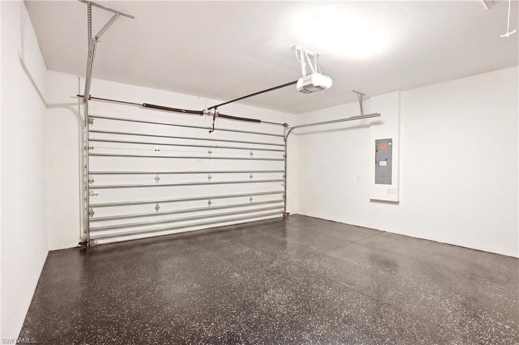 7157 Dominica Drive Naples, FL 34113 - Photo 27 of 39 a view of empty room with stairs and wooden floor