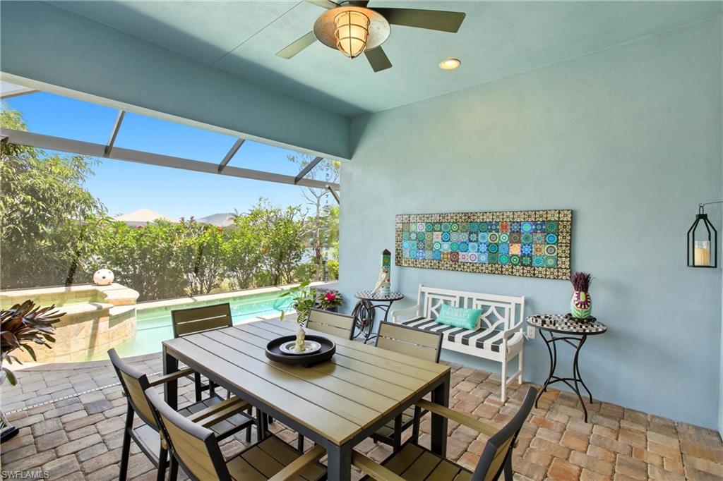 7157 Dominica Drive Naples, FL 34113 - Photo 28 of 39 a view of a dining room with furniture window and outside view
