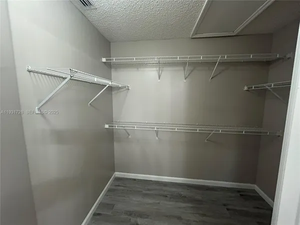 a kitchen with kitchen island granite countertop a stove and a sink