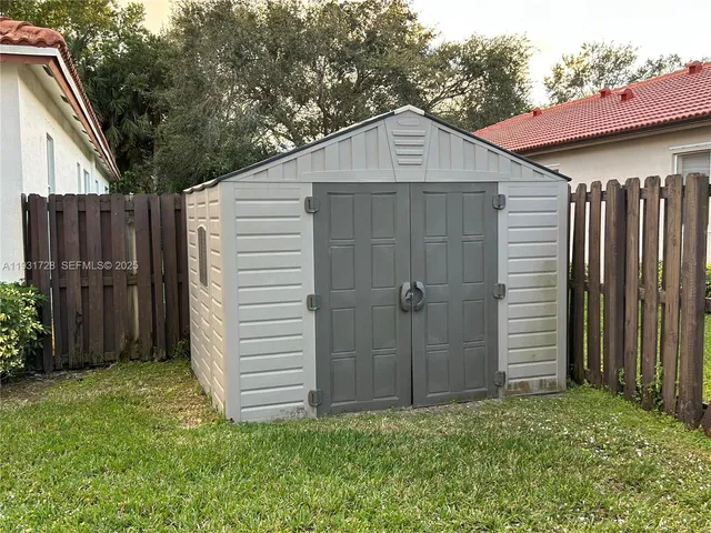 a house view with a backyard space