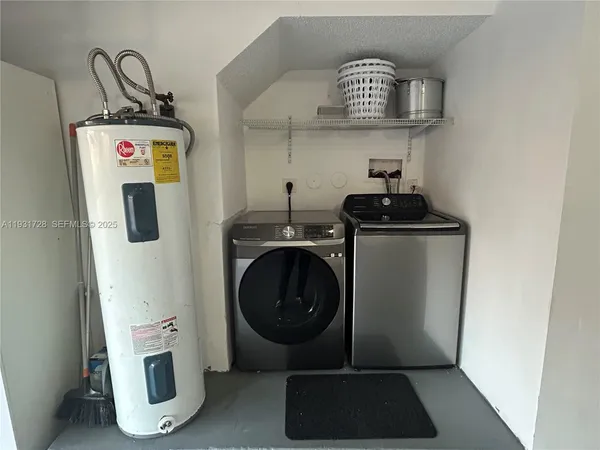 a view of storage and utility room with washer and dryer