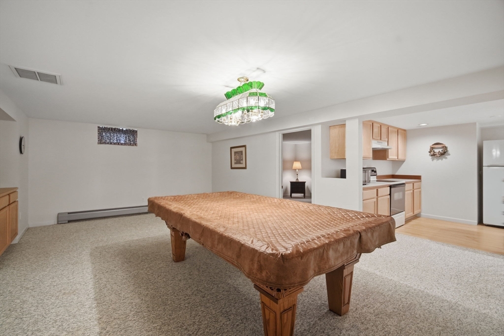 30 Birch Hill Road Northampton, MA 01062 - Photo 34 of 42 a spacious bedroom with a table chairs and a bed