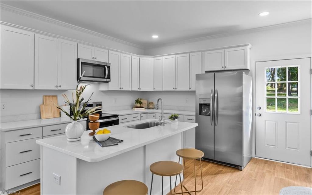 1622 Rankin Road Greensboro, NC 27405 - Photo 5 of 23 This amazing kitchen has plenty of ocunter and cabinet space...And access to the back yard and deck.