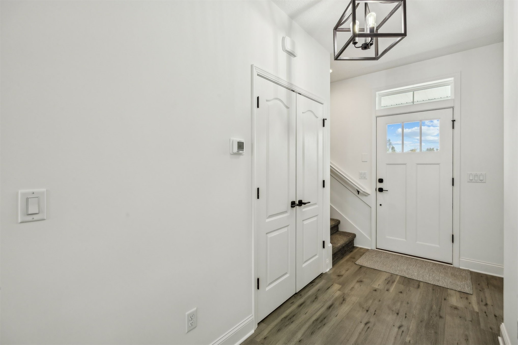 15466 Bullock Bluff Road Bryceville, FL 32009 - Photo 12 of 54 a view of a hallway with wooden floor and entryway