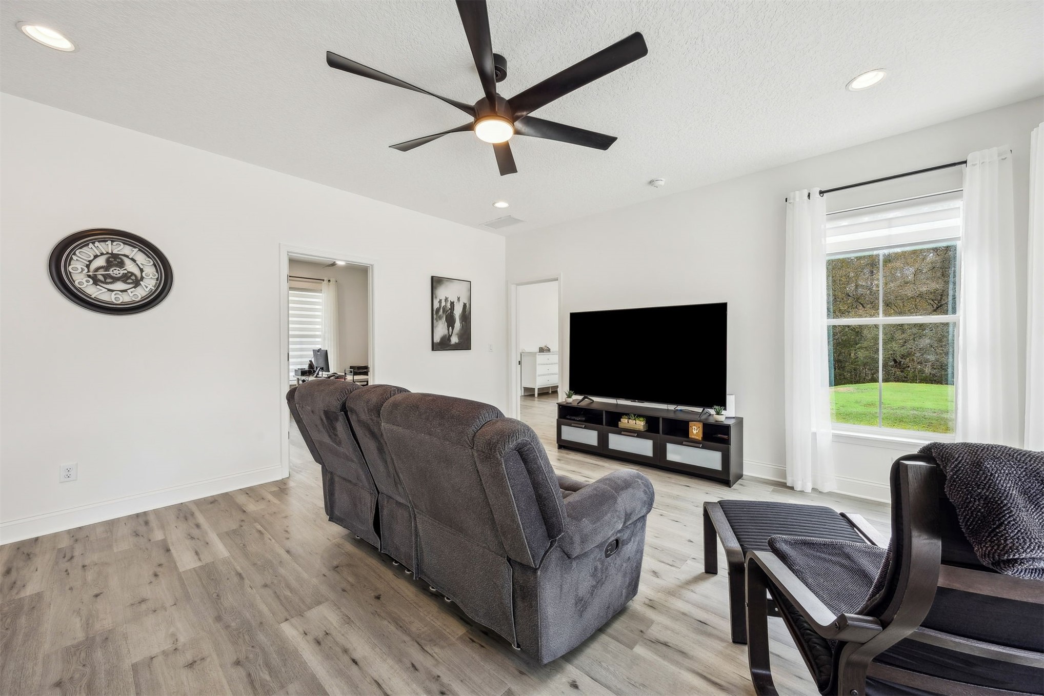 15466 Bullock Bluff Road Bryceville, FL 32009 - Photo 14 of 54 a living room with furniture and a flat screen tv