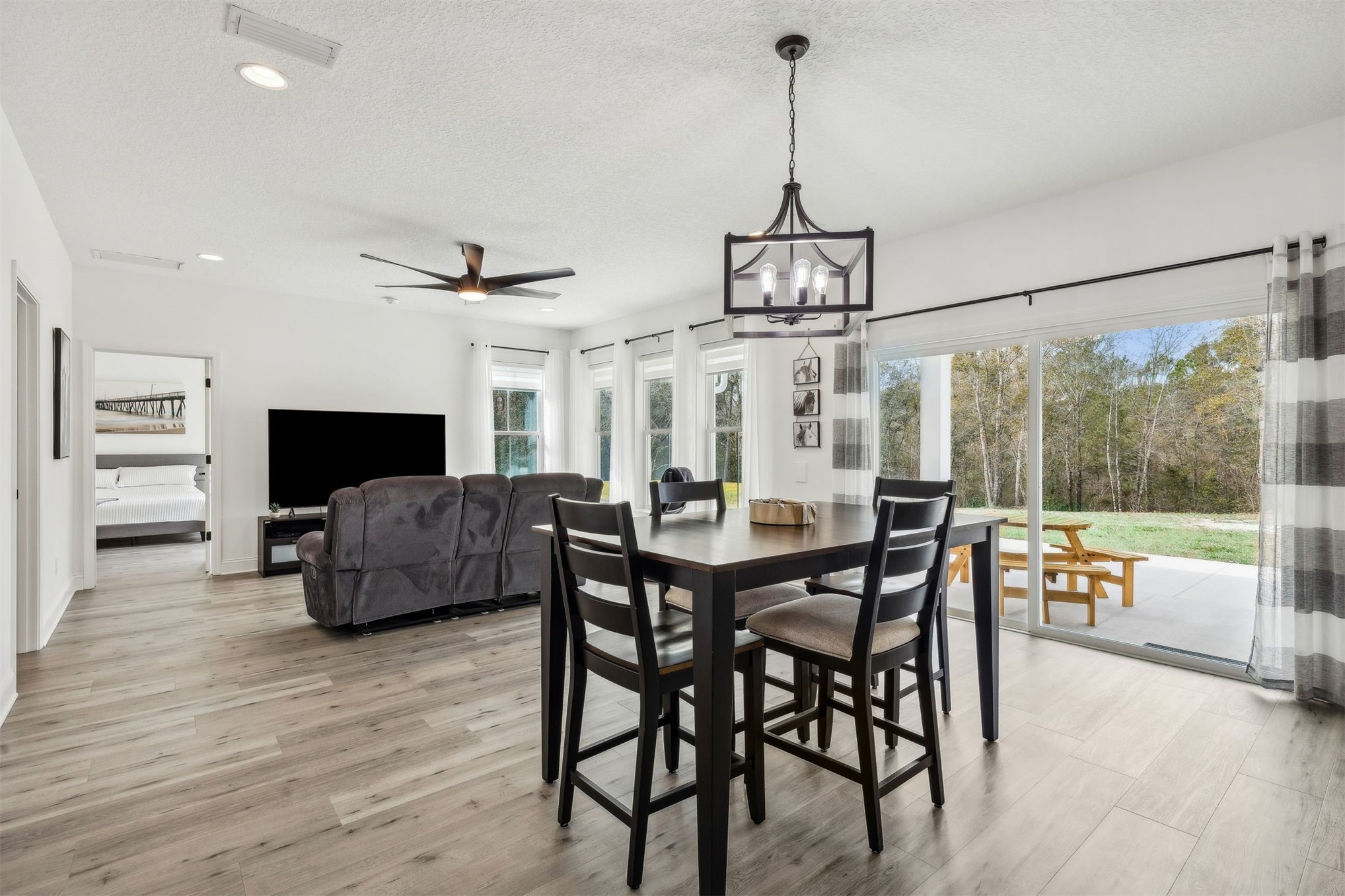 15466 Bullock Bluff Road Bryceville, FL 32009 - Photo 17 of 54 a view of a dining room with furniture window and wooden floor