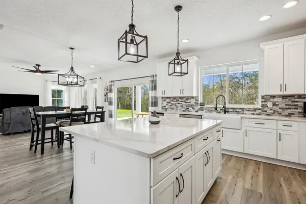 a kitchen with a sink cabinets and window