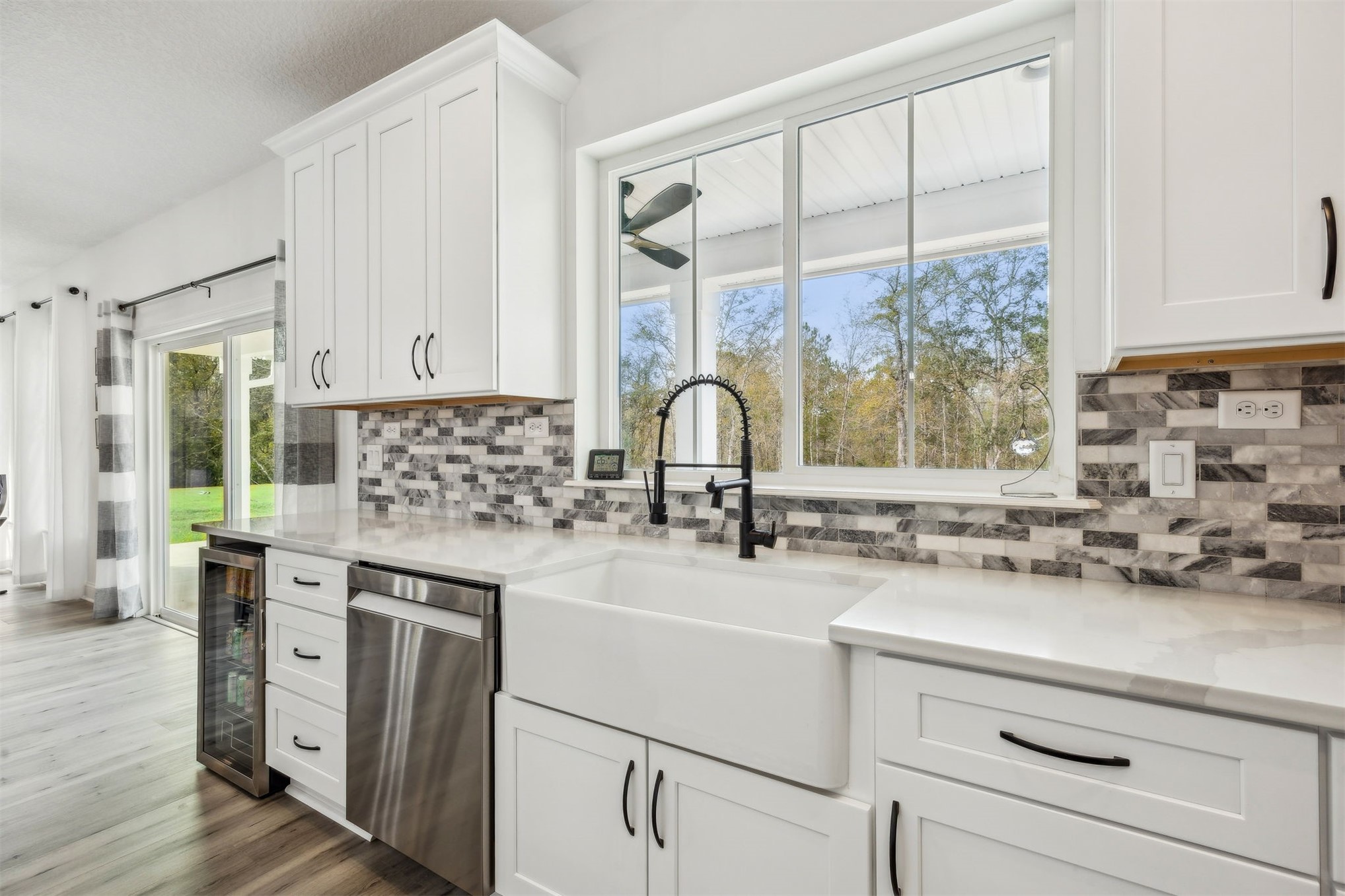 15466 Bullock Bluff Road Bryceville, FL 32009 - Photo 20 of 54 a kitchen with a sink cabinets and window
