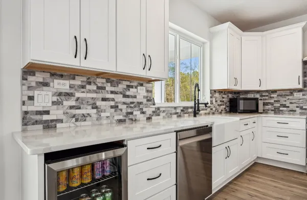 a kitchen with appliances and cabinets