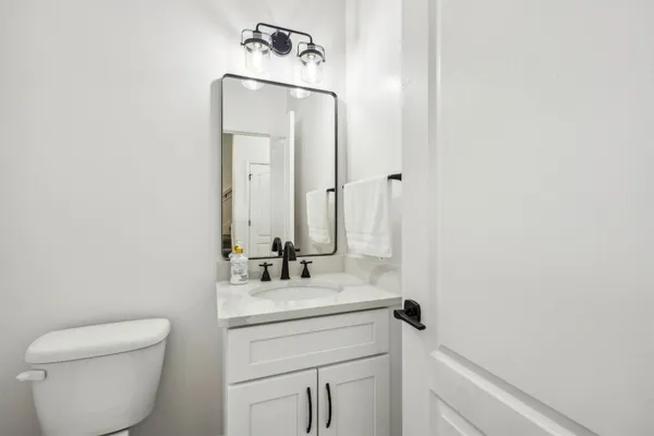 a spacious bedroom with a bed and a window