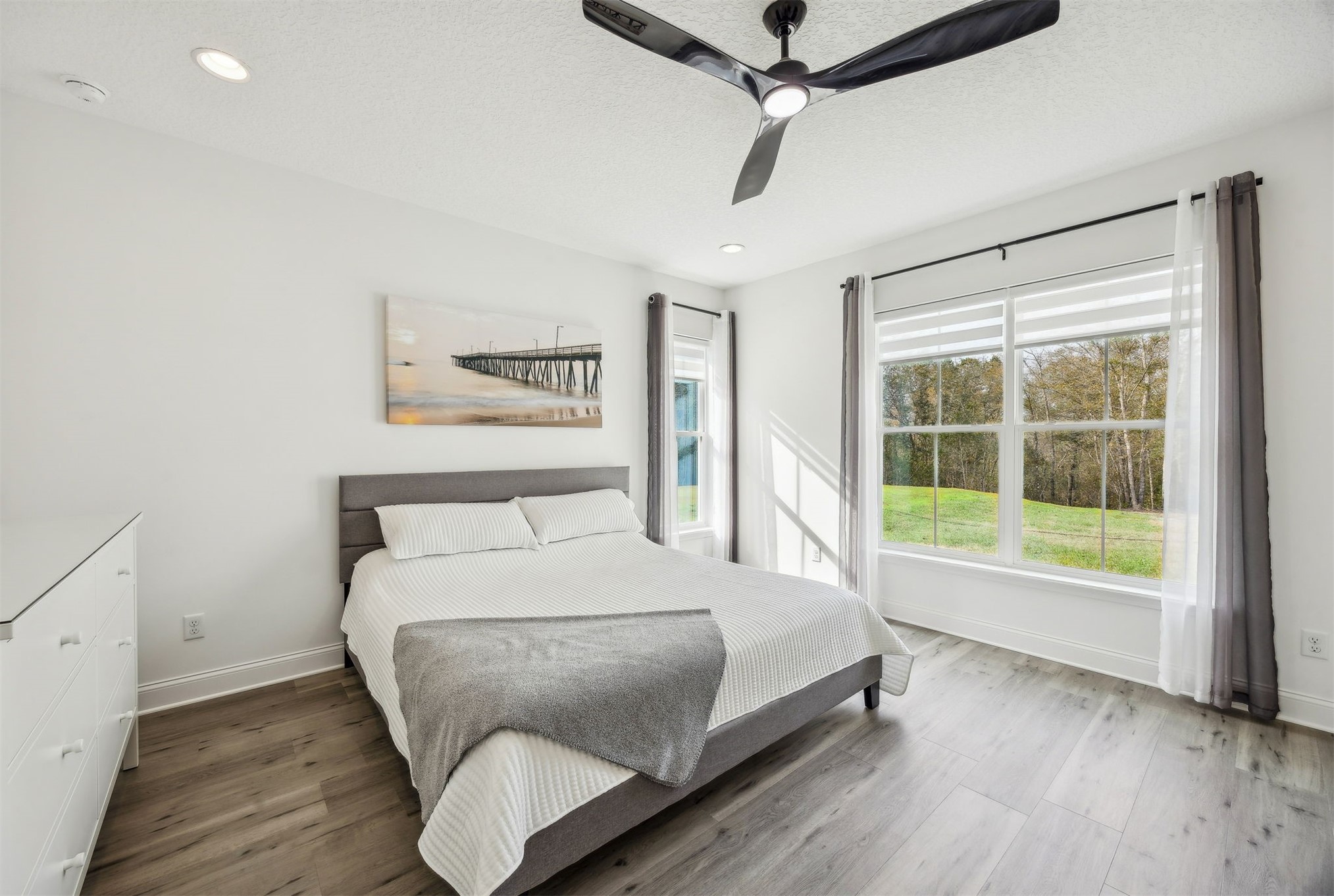 15466 Bullock Bluff Road Bryceville, FL 32009 - Photo 25 of 54 a bed sitting in a bedroom next to a window