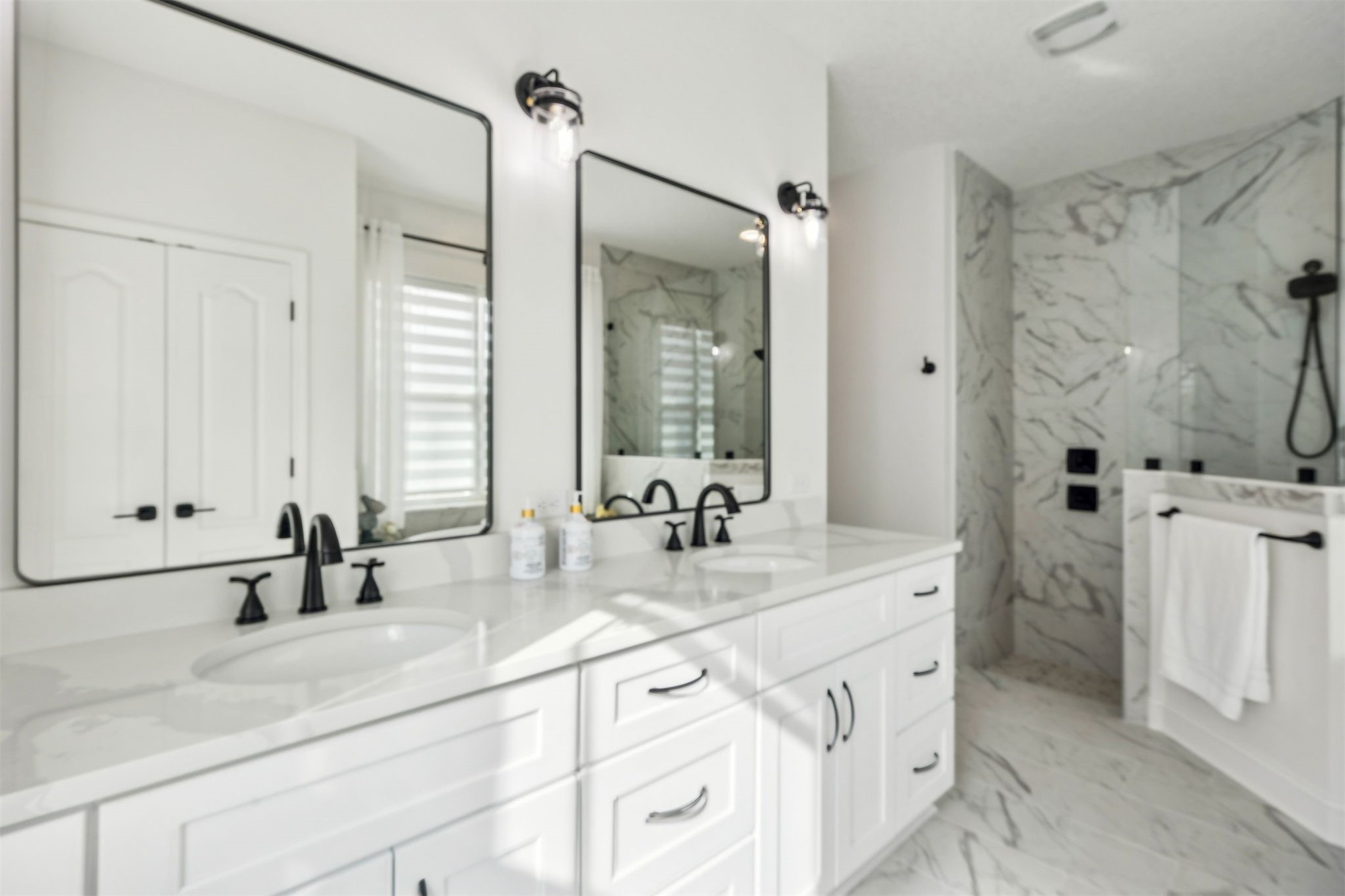 15466 Bullock Bluff Road Bryceville, FL 32009 - Photo 27 of 54 a bathroom with a double vanity sink mirror and double