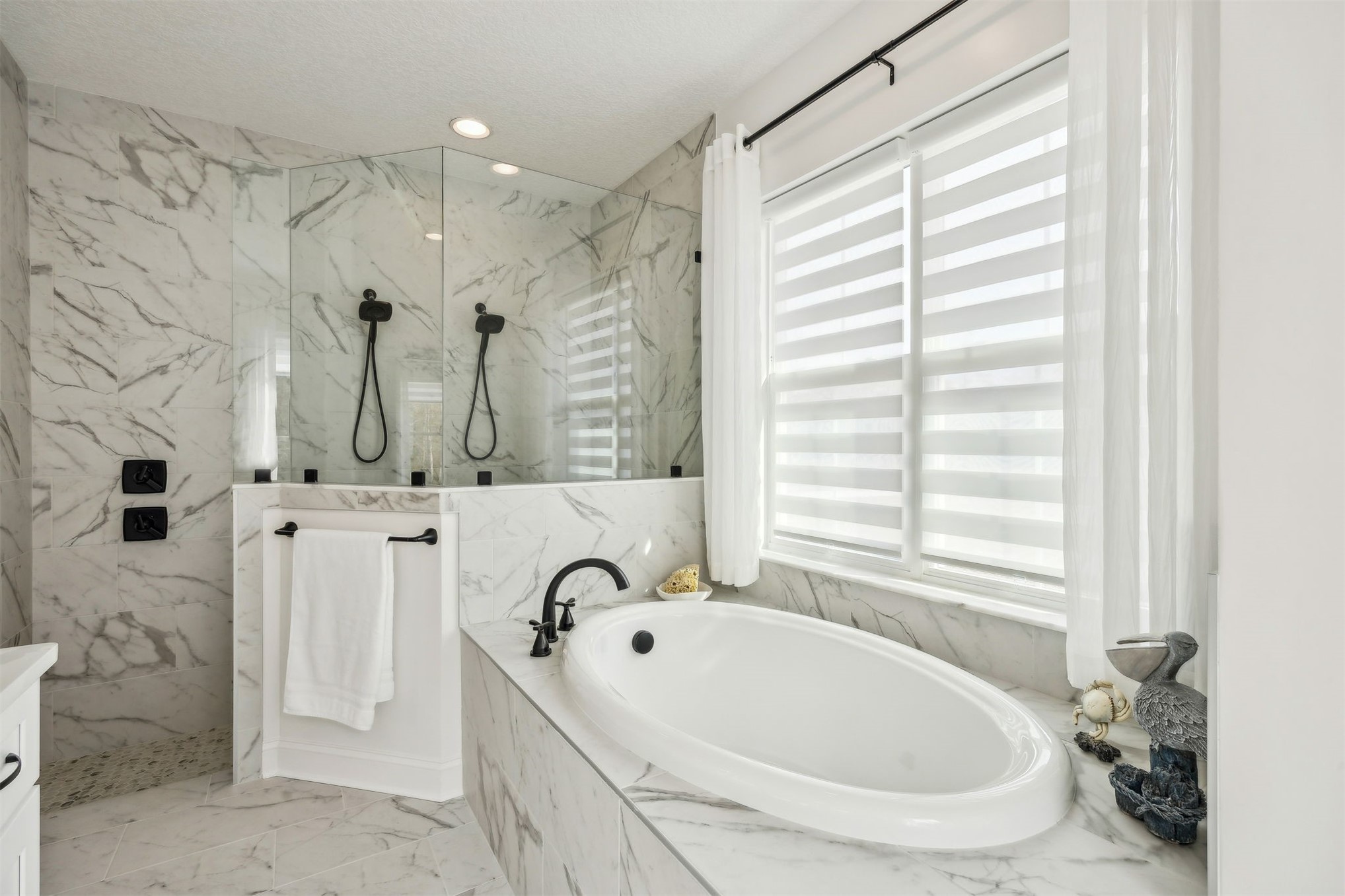 15466 Bullock Bluff Road Bryceville, FL 32009 - Photo 28 of 54 a bathroom with a tub a sink and a window