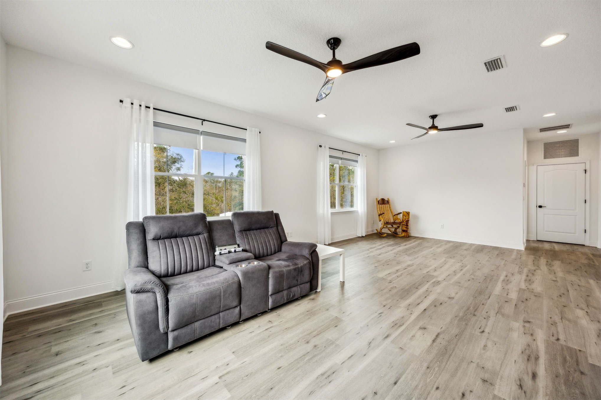 15466 Bullock Bluff Road Bryceville, FL 32009 - Photo 35 of 54 a living room with furniture and a wooden floor