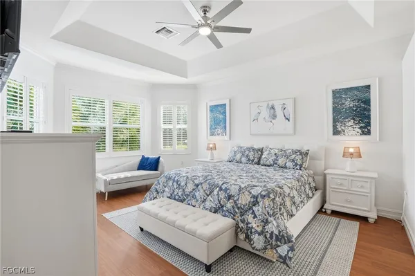 a bedroom with a bed couch and window