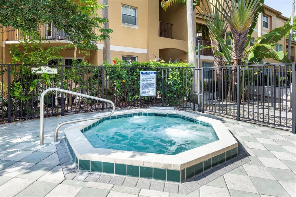 741 North Pine Island Road, Unit 303 Plantation, FL 33324 - Photo 22 of 32 a view of backyard with swimming pool and outdoor seating