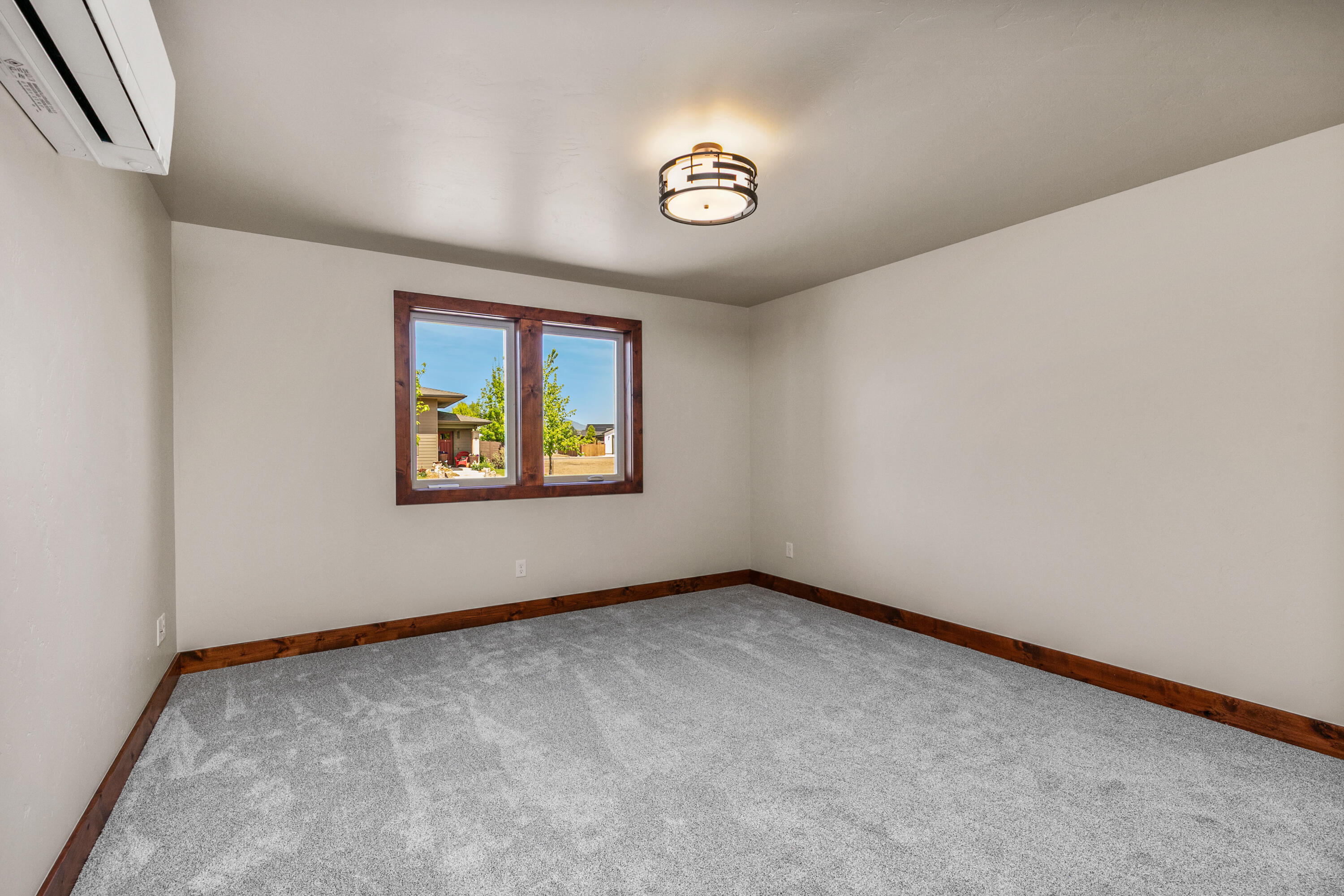 1472 Northeast Hudspeth Road Prineville, OR 97754 - Photo 14 of 26 an empty room with a window