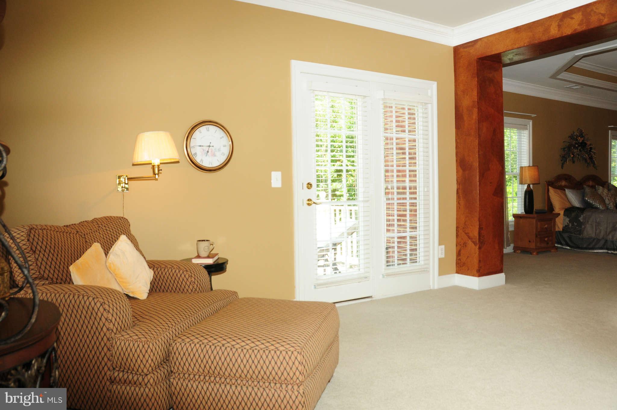 19123 Stream Crossing Court Leesburg, VA 20176 - Photo 11 of 30 Sitting room in MBR features door to private porch