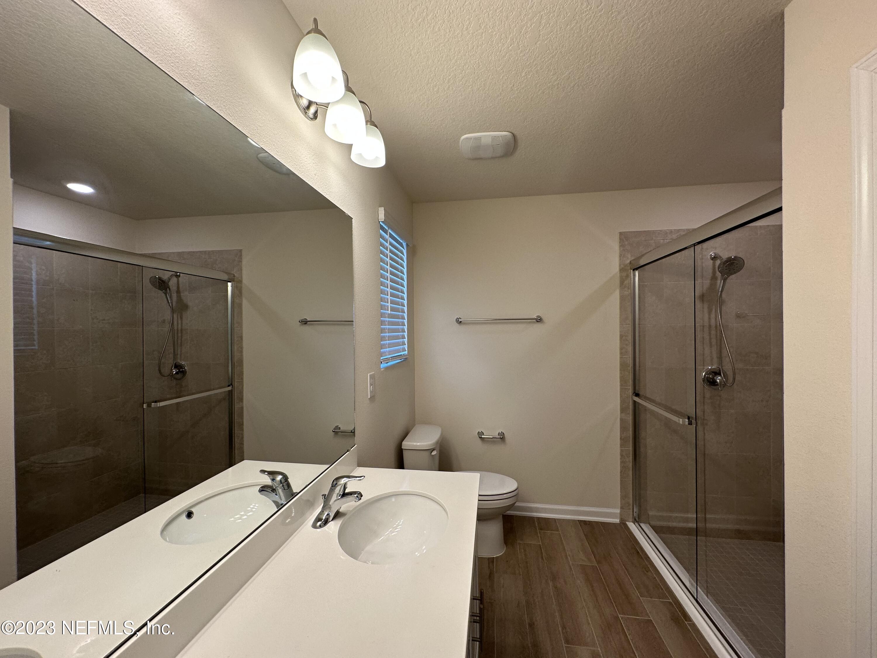 137 Chasewood Drive St. Augustine, FL 32095 - Photo 14 of 29 a bathroom with a sink a toilet and shower