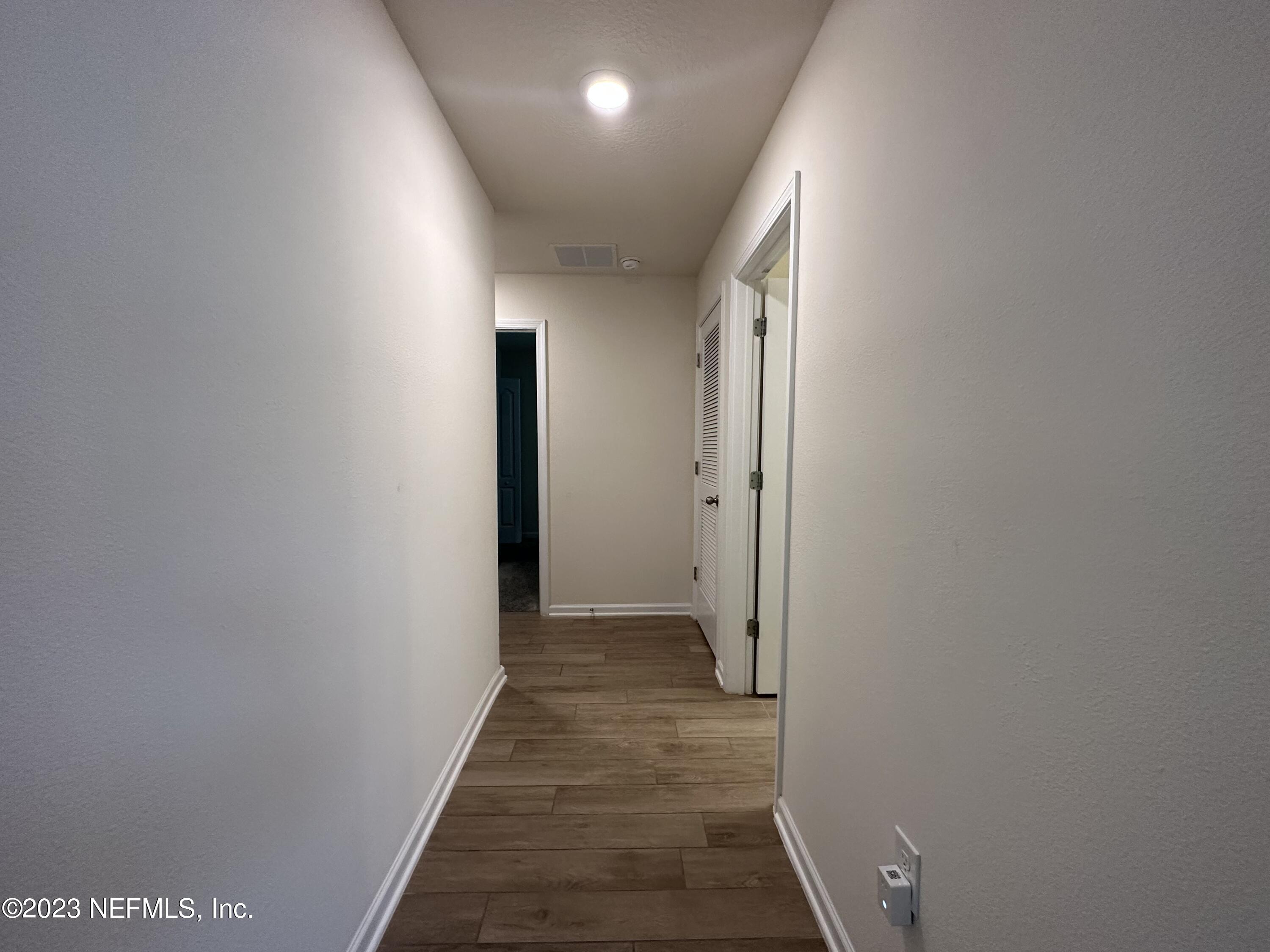 137 Chasewood Drive St. Augustine, FL 32095 - Photo 16 of 29 a view of hallway with wooden floor