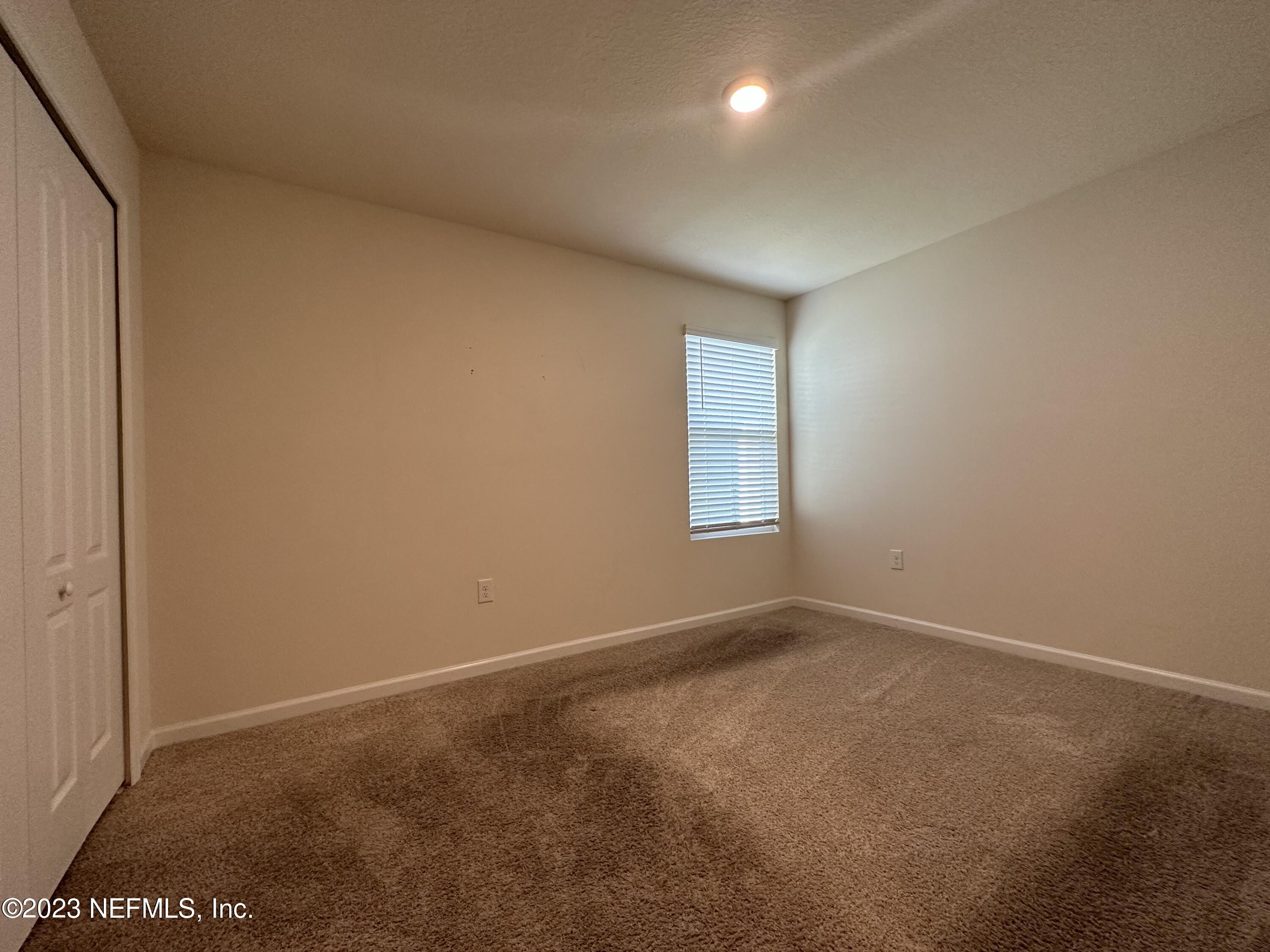 137 Chasewood Drive St. Augustine, FL 32095 - Photo 17 of 29 an empty room with windows