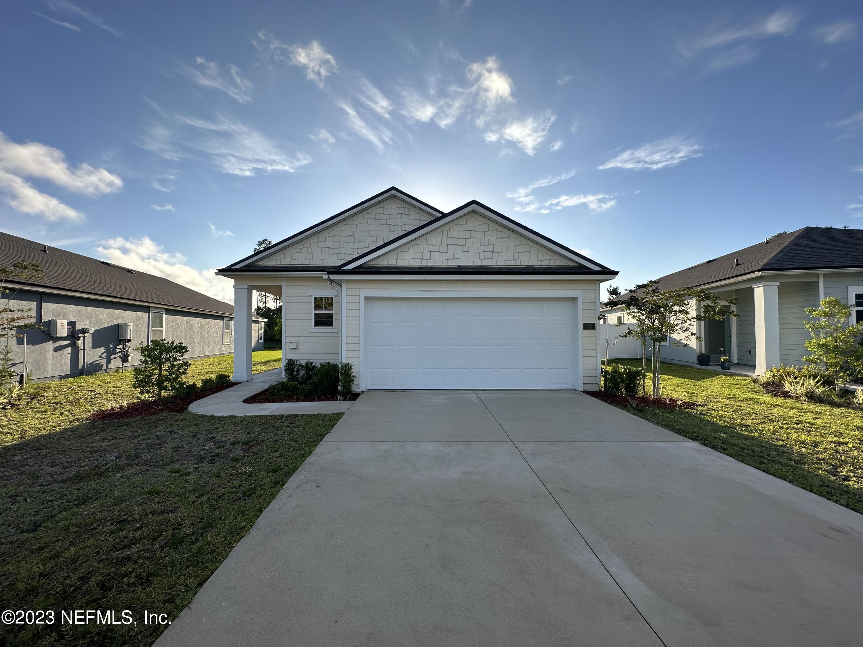 137 Chasewood Drive St. Augustine, FL 32095 - Photo 4 of 29 a view of a house with backyard and garden