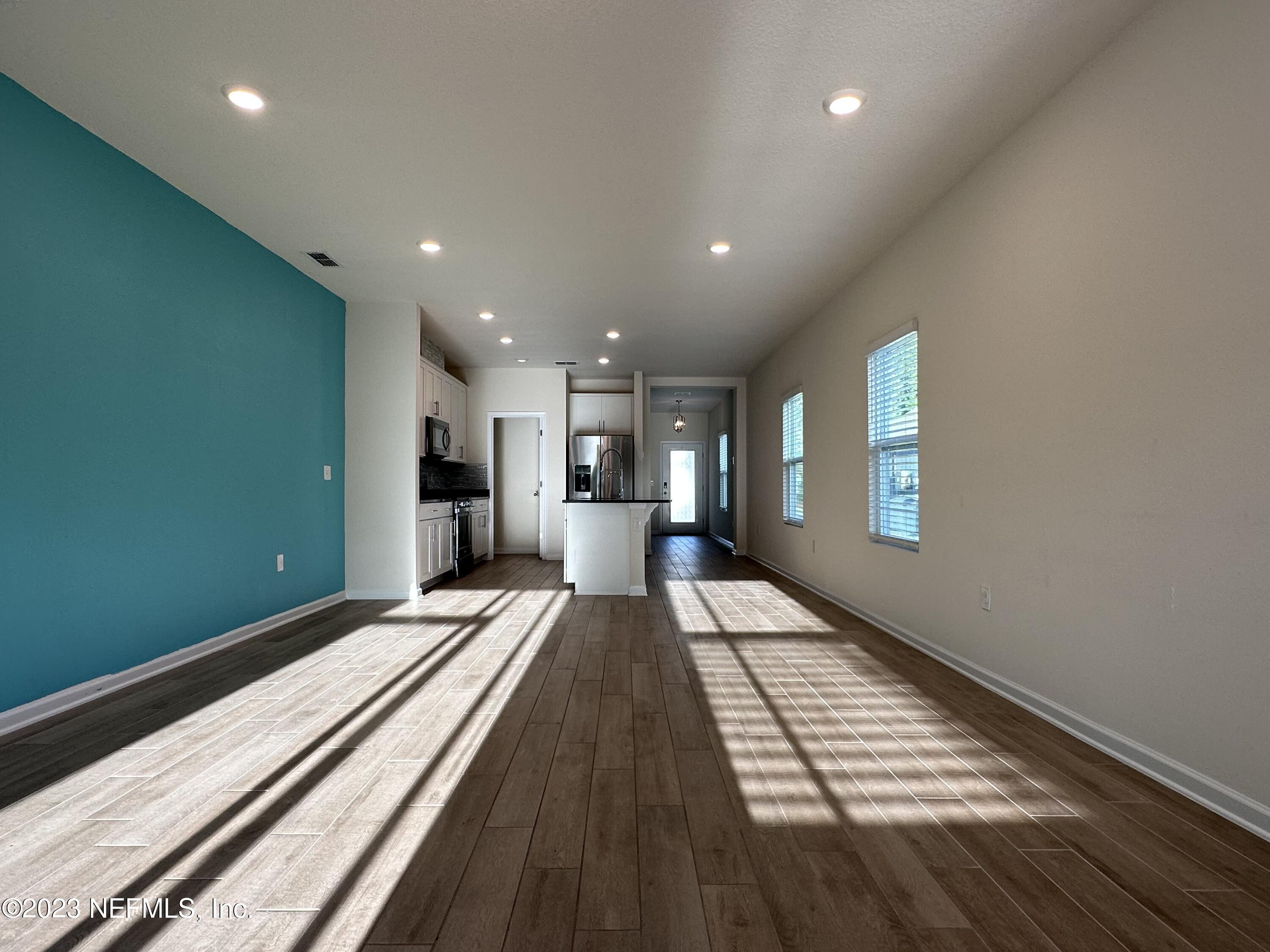 137 Chasewood Drive St. Augustine, FL 32095 - Photo 8 of 29 a view of a room with wooden floor