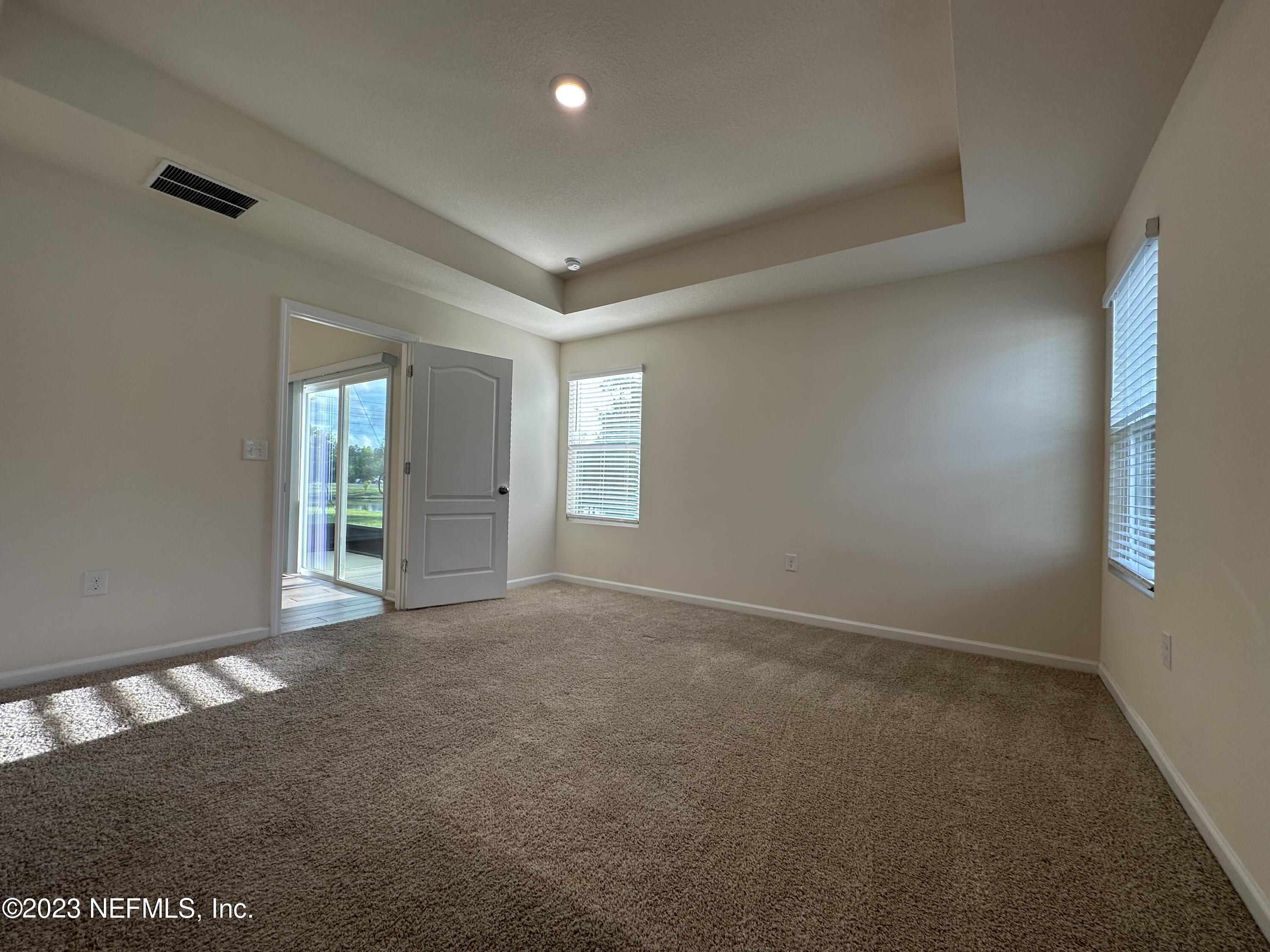 137 Chasewood Drive St. Augustine, FL 32095 - Photo 10 of 29 an empty room with windows