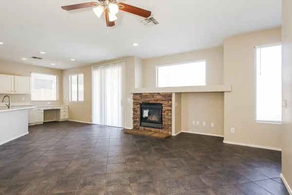 a view of a kitchen with a window and a fireplace