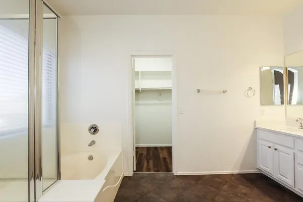 a bathroom with a bathtub and a sink