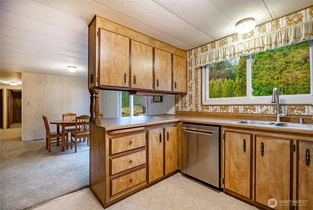 a kitchen with a sink and cabinets