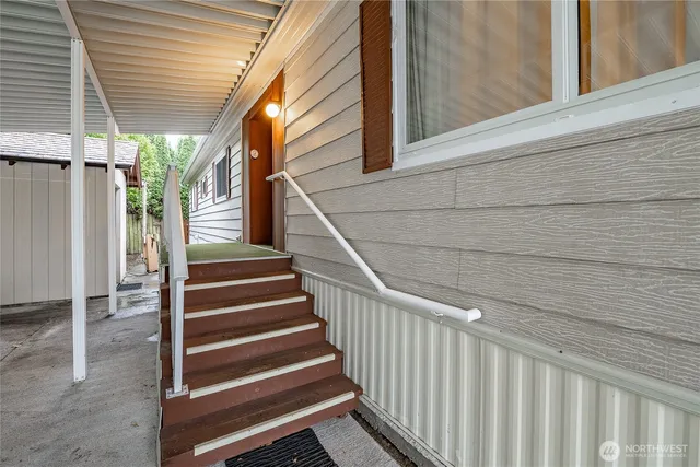 a view of entryway with wooden floor and a window