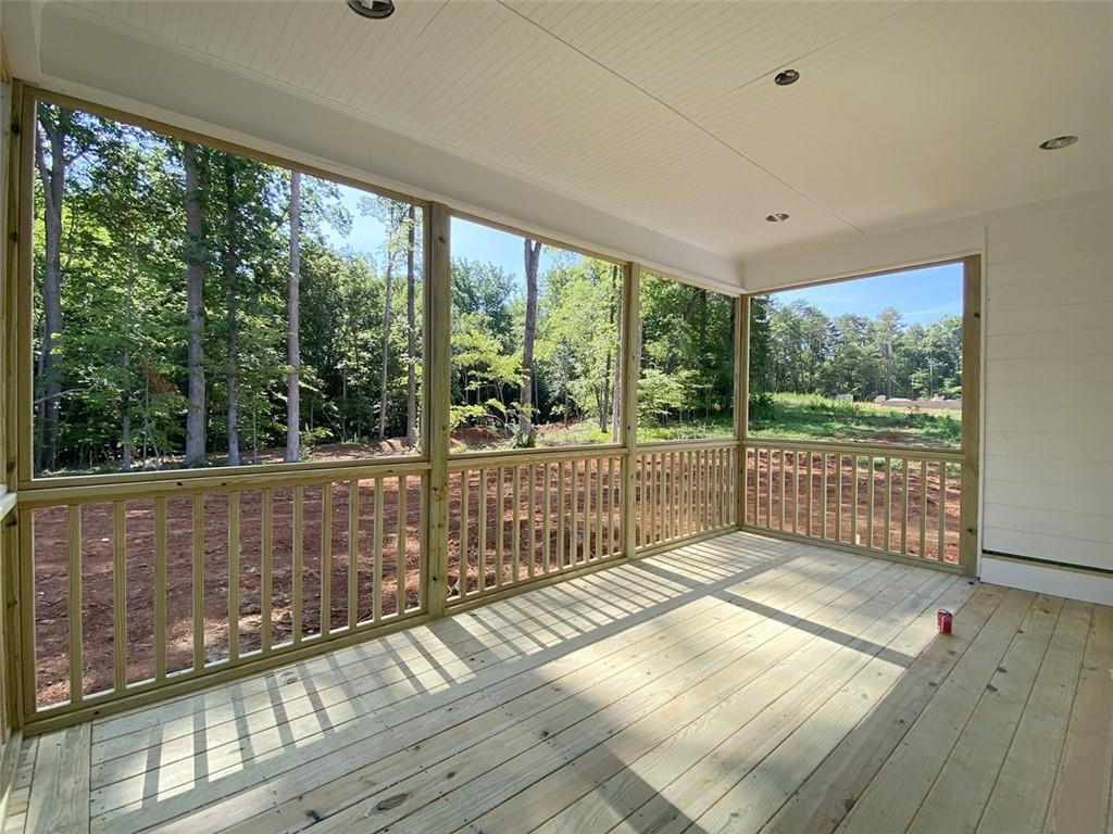 7584 Cypress Drive Graham, NC 27253 - Photo 12 of 18 a view of a balcony with wooden floor