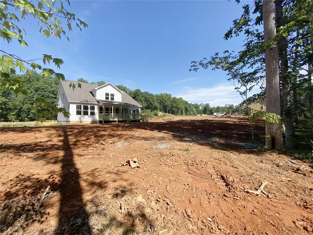 7584 Cypress Drive Graham, NC 27253 - Photo 15 of 18 a front view of a house with a yard